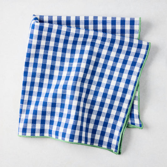 Chatham Blue Gingham Cotton Napkin, 22" square, with green embroidered trim.