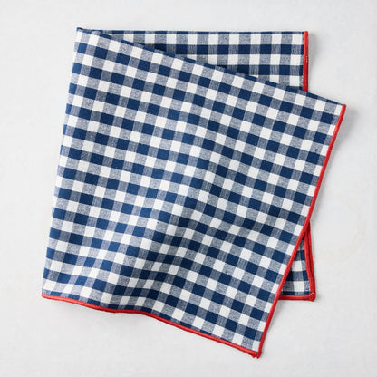 Chatham Navy Blue Gingham Cotton Napkin, 22" square, with red embroidered trim.