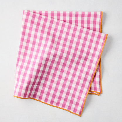 Chatham Pink Gingham Cotton Napkin with Orange Trim, folded.