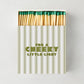 Hudson Grace oversized matches in a striped box with green tips and the text For a Cheeky Little Light