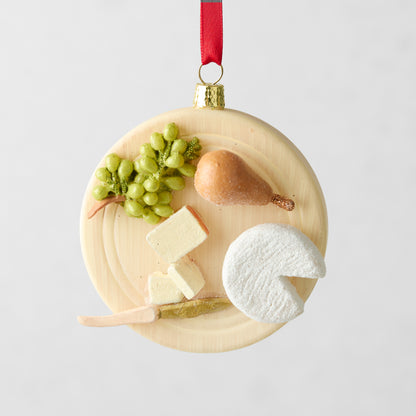 3.25-inch round glass and resin cheese plate Christmas ornament with hand-painted grapes, pear, and cheese slices.