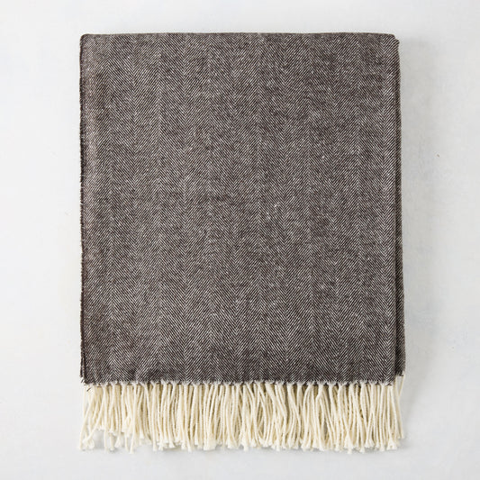 Chestnut brown Italian herringbone throw blanket with cream fringe.