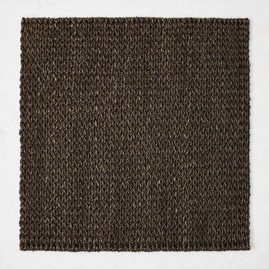 16-inch square chocolate brown abaca placemat with a textured, hand-woven design on a white background.