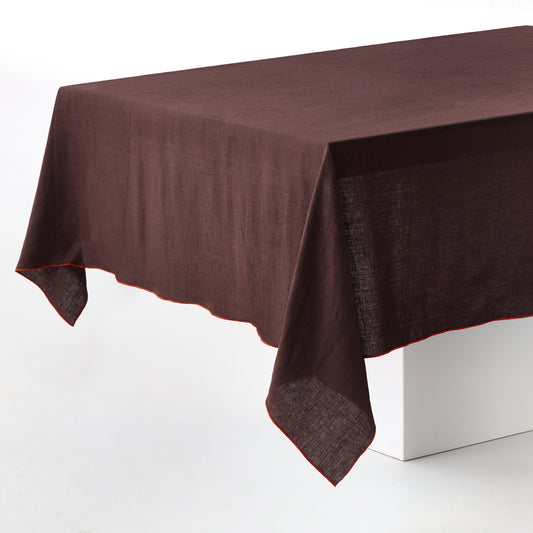Chocolate brown 100% linen tablecloth with embroidered brick red tipped stitching on edges.
