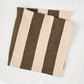 Folded Chocolate Brown Hampton Stripe natural cotton napkin, 22" square.