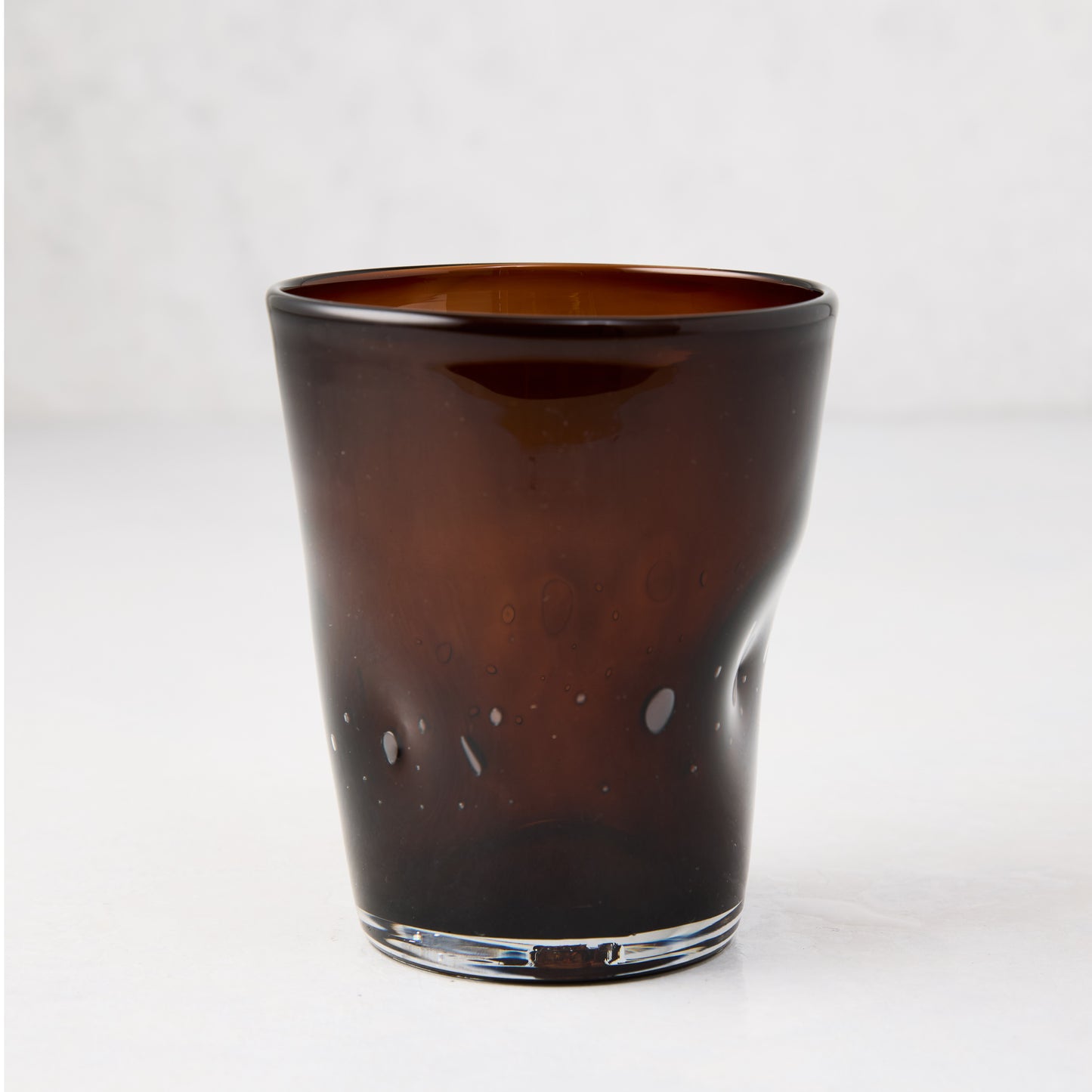Chocolate brown Henri mouth-blown glass, 8 oz., with unique imperfections and air bubbles.