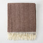 Chocolate brown Italian herringbone throw blanket with cream fringe.