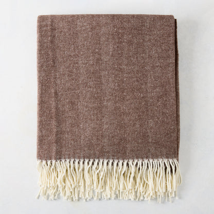 Chocolate brown Italian herringbone throw blanket with cream fringe.