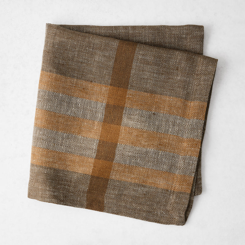 Chocolate brown and camel plaid linen napkin with a herringbone weave, 21-inch square.