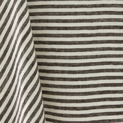 Chocolate brown and white ticking stripe linen tablecloth with a classic striped pattern and textured fabric weave.