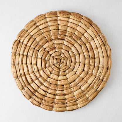 Chunky natural seagrass round woven placemat, 16", with a thick, robust weave.