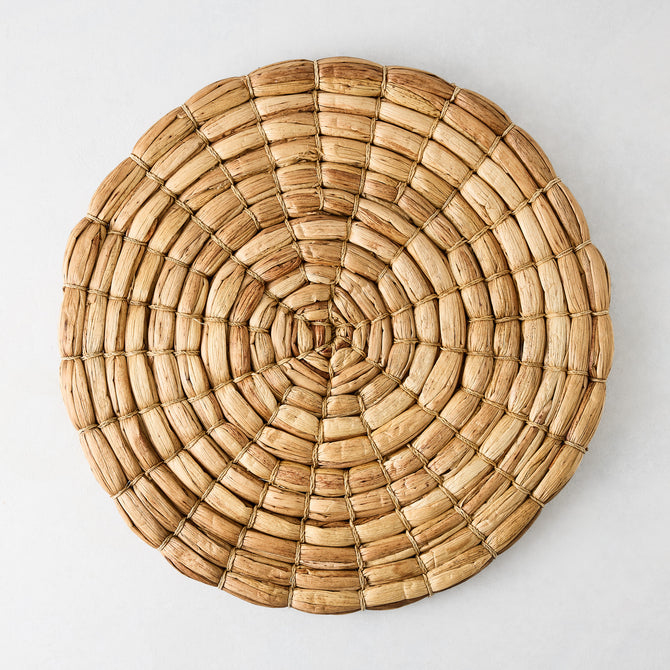 Chunky natural seagrass round woven placemat, 16", with a thick, robust weave.