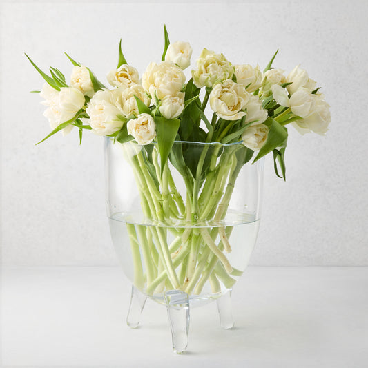 Cis Small Scissor-Cut Glass Bowl with three feet, holding a bouquet of white tulips.