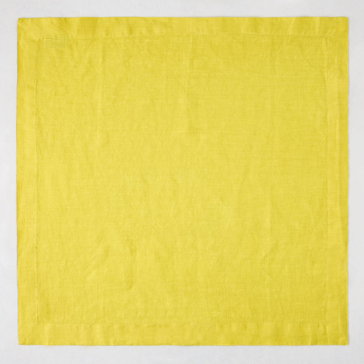 Citron HG Signature hand-dyed 22-inch square linen napkin in bright lemon yellow with mitered corners.
