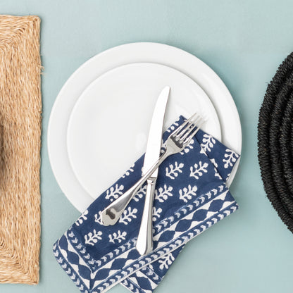 HG City White Porcelain Dinner Plate, 11", with a blue patterned napkin and silverware.