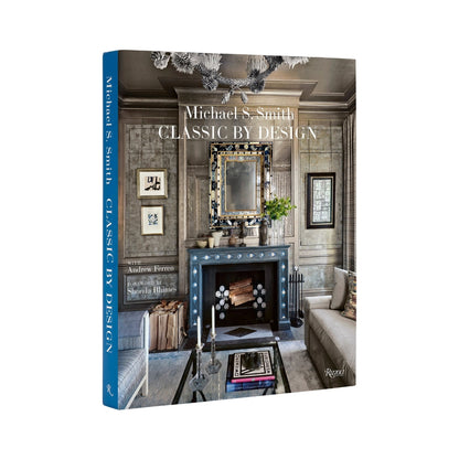 Hardcover book "Classic by Design" by Michael S. Smith, featuring a dark gray interior design photo on the cover.