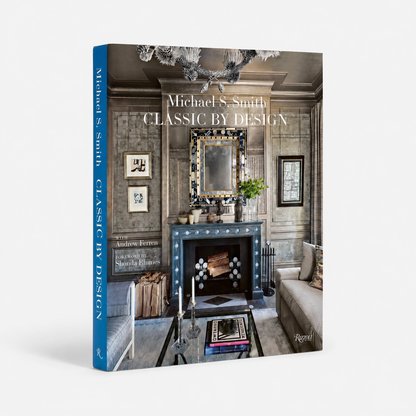 A hardcover book titled "Michael S. Smith Classic by Design" standing upright on a light gray background.
