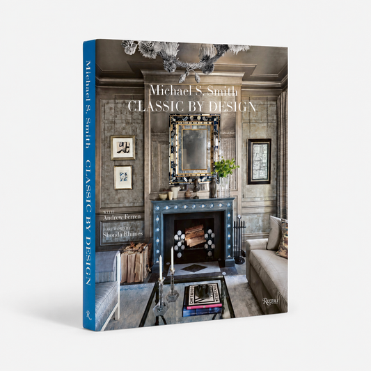 A hardcover book titled "Michael S. Smith Classic by Design" standing upright on a light gray background.