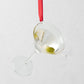 2.5-inch glass martini ornament with a green olive garnish, hanging from a red ribbon.