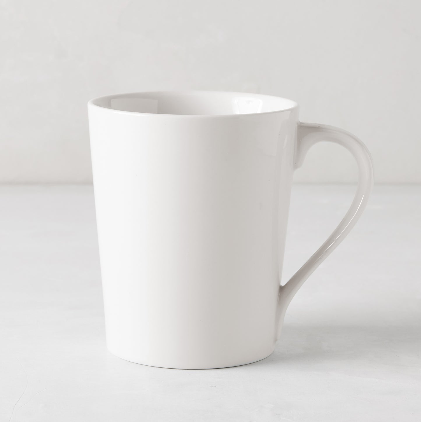 HG Classic Porcelain Mug, white, 14.8oz, 3.5" D x 4.5" H, with clean lines and modern aesthetic.
