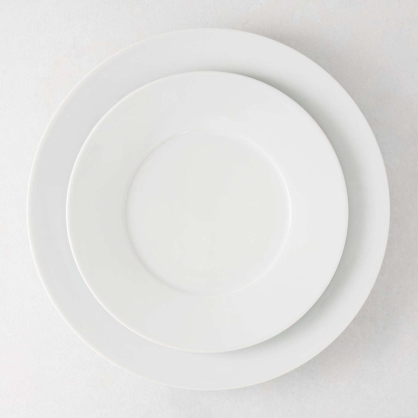 HG Classic Porcelain Salad Plate, 8.5" diameter, stacked on a larger white plate.