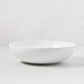HG Classic 10.5" white porcelain serve bowl with a sleek, simple shape.