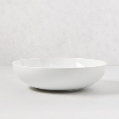 HG Classic 10.5" white porcelain serve bowl with a sleek, simple shape.