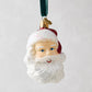 Glass Santa head Christmas tree ornament with glittery white beard, red hat, and blue eyes.