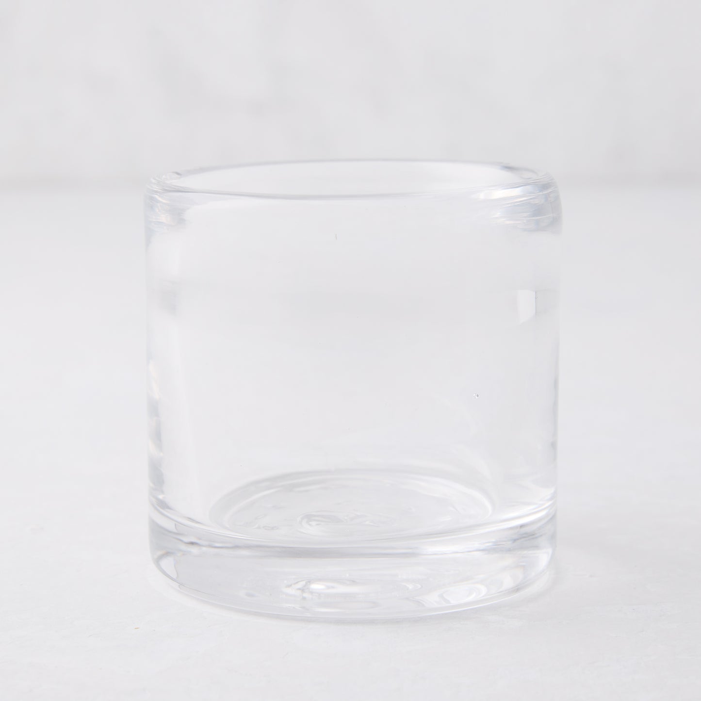 Clear glass votive candle holder, 2.75"Dia x 2.75"H, mouth-blown and hand-formed.