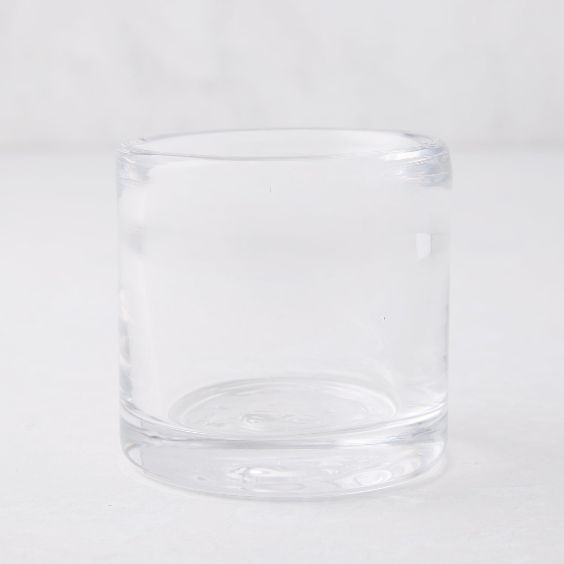 Clear glass votive candle holder, 2.75"Dia x 2.75"H, mouth-blown and hand-formed.