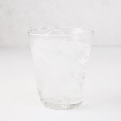 Clear Henri 8 oz. mouth-blown glass with ice and water, handmade.