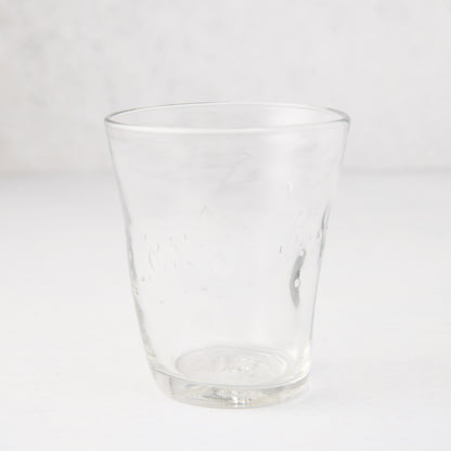 Clear Henri mouth-blown glass, 8 oz, with unique imperfections and small air bubbles.
