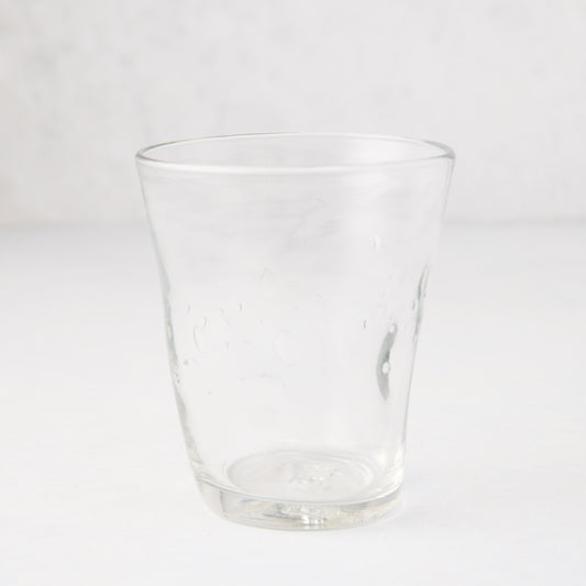 Clear Henri mouth-blown glass, 8 oz, with unique imperfections and small air bubbles.