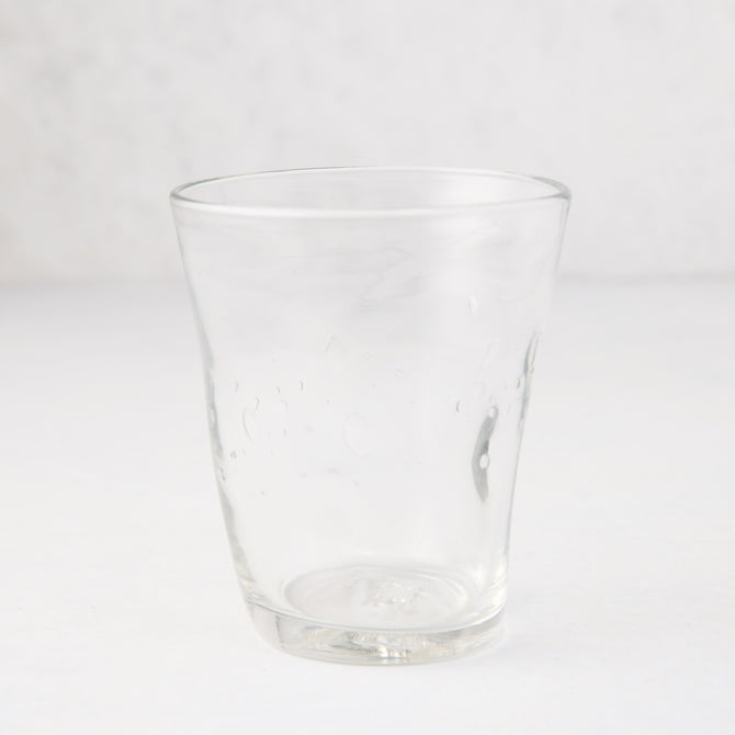 Clear Henri mouth-blown glass, 8 oz, with unique imperfections and small air bubbles.