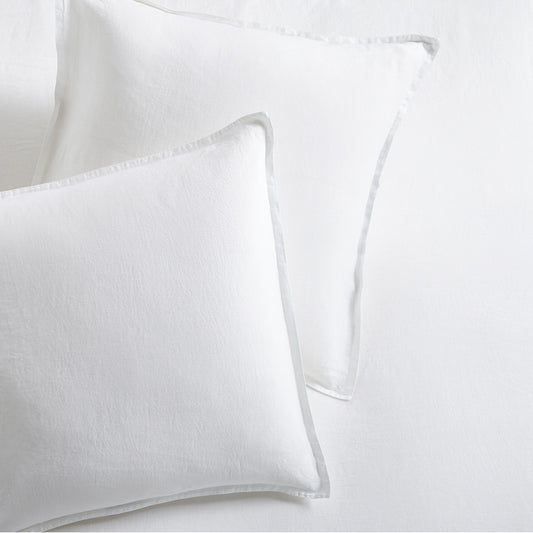 Set of two cloud white European washed linen euro shams with a soft, textured finish and flange edges.