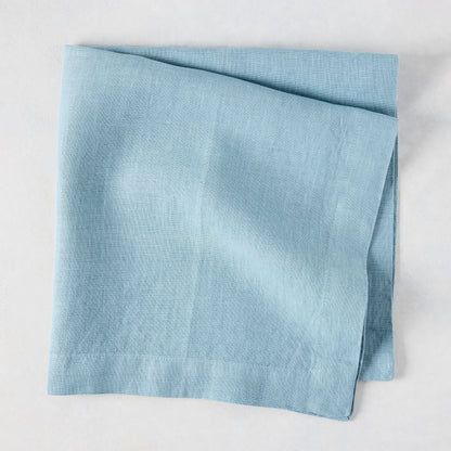 Cloudy HG Signature Hand-dyed Linen Napkin, folded, 22-inch square, muted blue-gray.