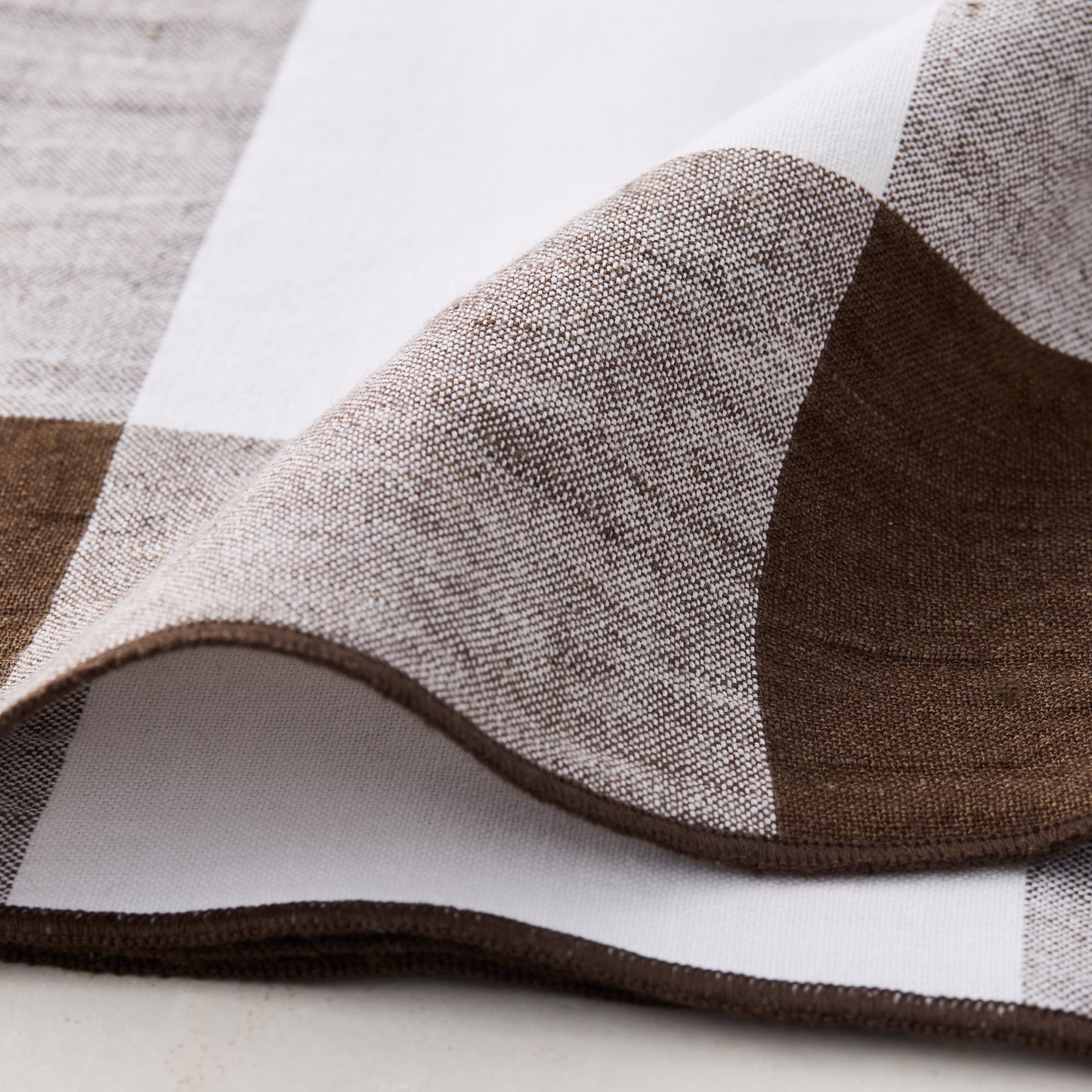 Cocoa brown buffalo check linen napkin, 20x20, folded.