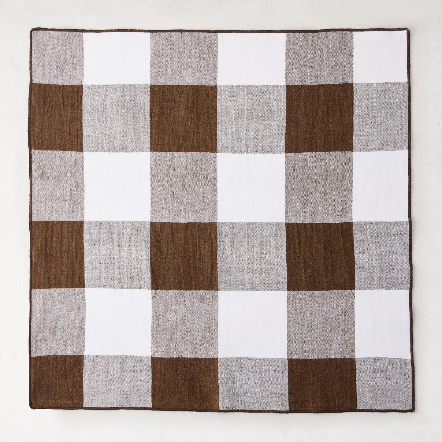 Cocoa brown buffalo check linen napkin, 20"x20", folded square.