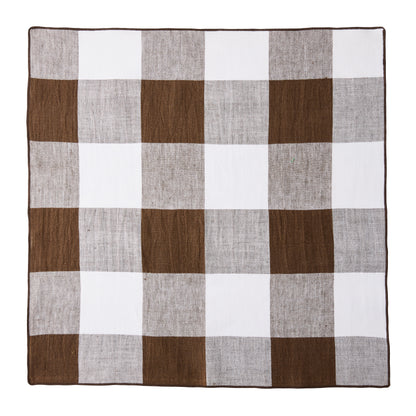 Cocoa brown buffalo check linen napkin, 20"x20", with white squares and a thin brown border.
