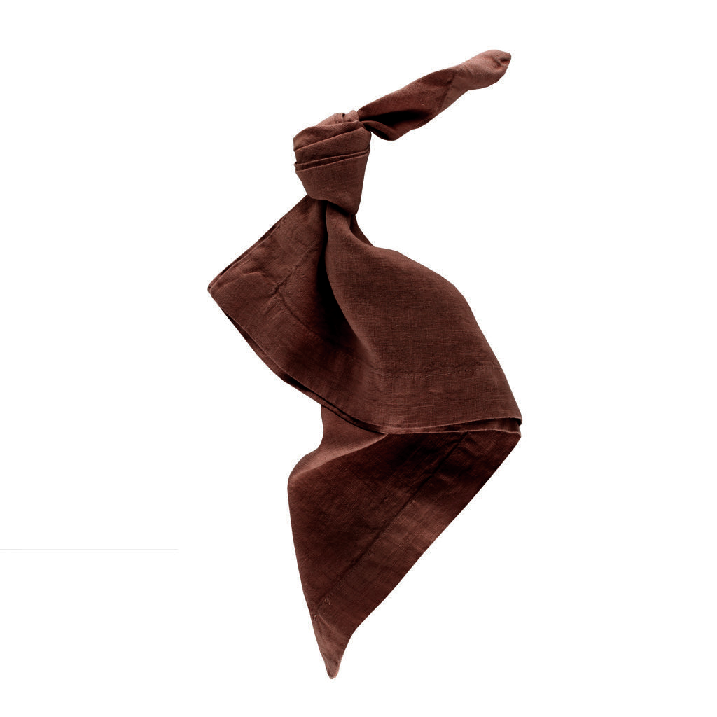 Cocoa HG brown hand-dyed linen napkin, 22-inch square, tied in a knot.