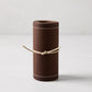 Roll of 50 cocoa brown cotton tear-off cocktail napkins with white dashed lines, tied with twine.