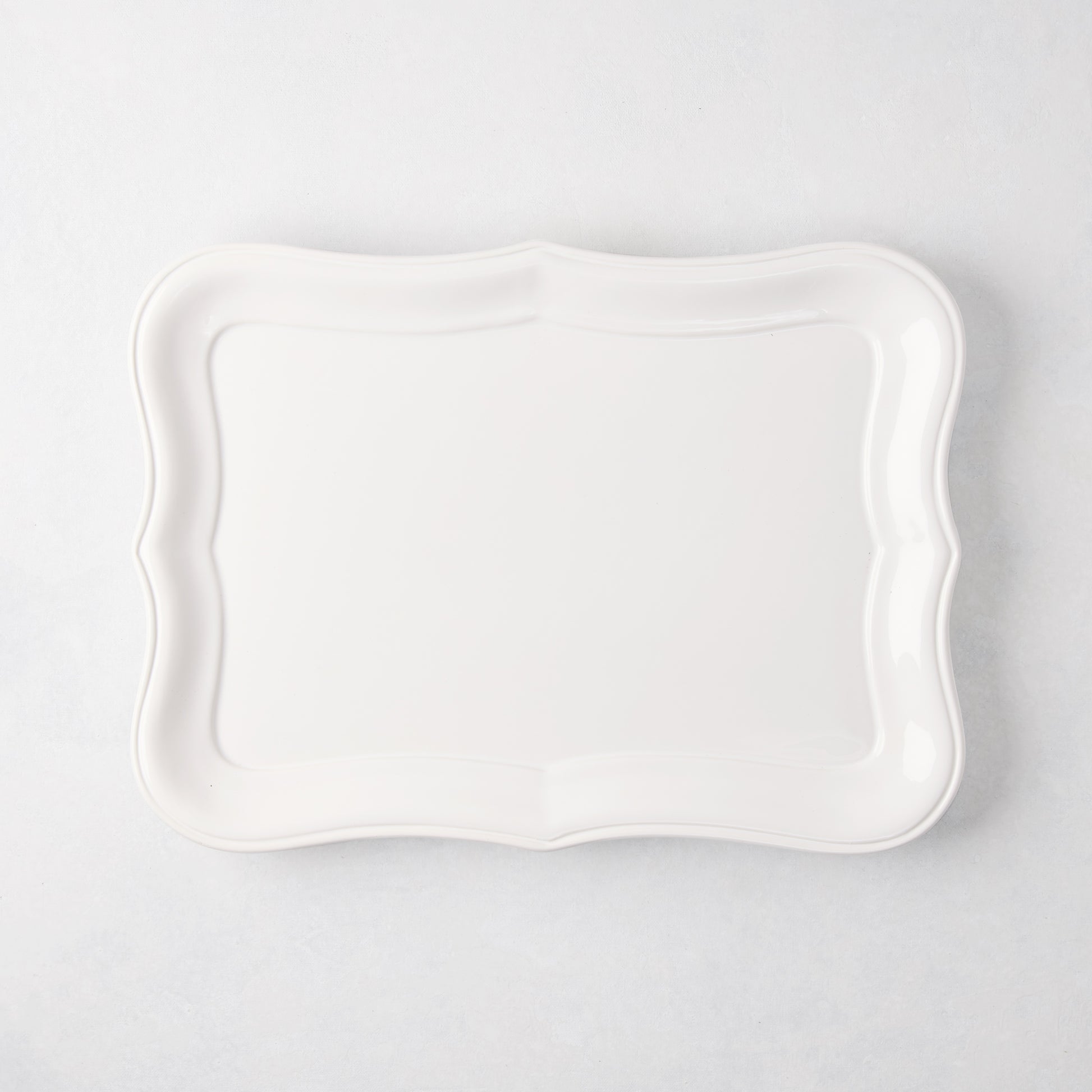 Colette Medium Ceramic Serving Platter, white with scalloped edges, 15.7"L x 11.4"W.