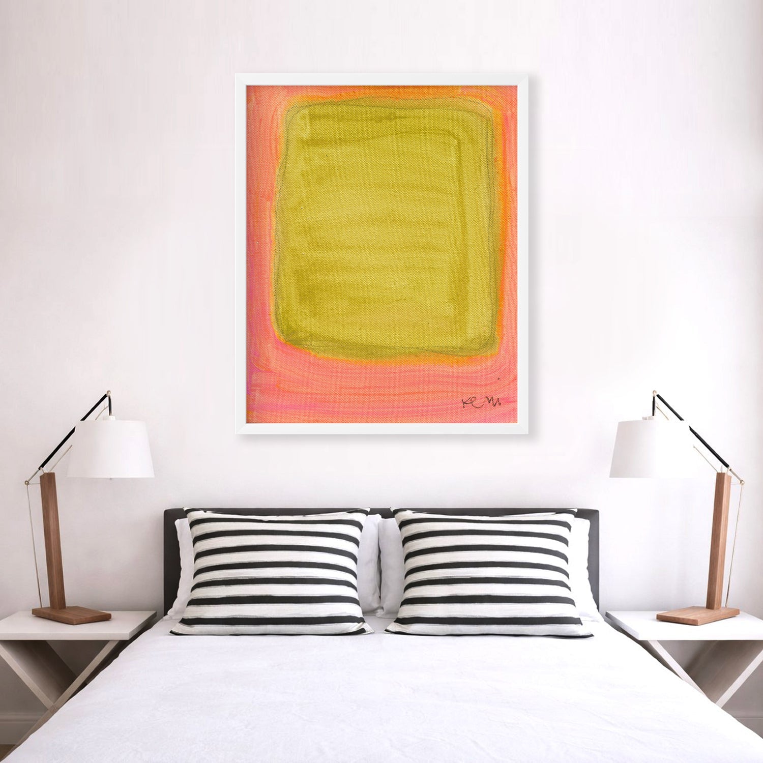 Color Note 1 Art Print by Kerri Rosenthal, abstract yellow-green rectangle on a pink background, white frame, above a bed.