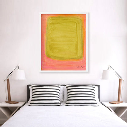 Color Note 1 Art Print by Kerri Rosenthal, abstract yellow-green rectangle on a pink background, white frame, above a bed.