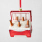 Red glass cooler ornament with beer bottles in ice, glittered.