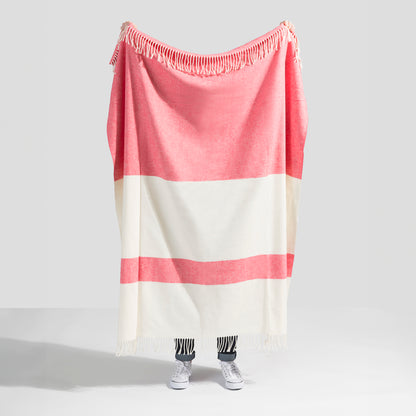 Sydney Herringbone Stripe Throw in coral and cream, cotton-acrylic blend with fringe.