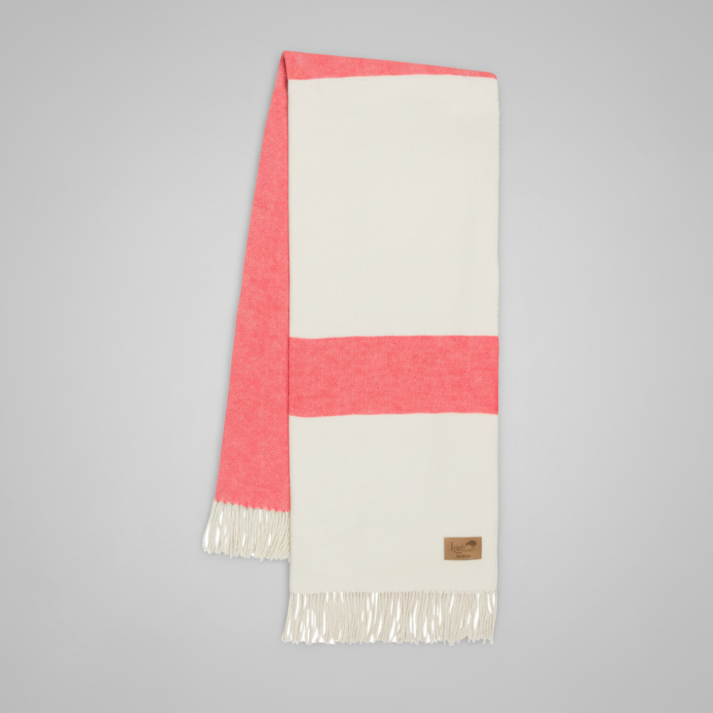 Coral and cream herringbone stripe throw blanket with fringe, 51" W x 67" L, cotton-acrylic blend.