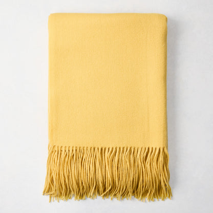 Corn yellow cashmere throw blanket with classic fringe, folded.