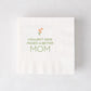 White paper cocktail napkin with "Couldn't Have Picked a Better Mom" in green, topped with orange tulips.