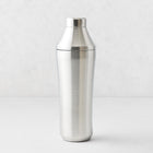 25oz brushed stainless steel cocktail shaker with integrated measuring cap and vacuum-insulated double-wall design.